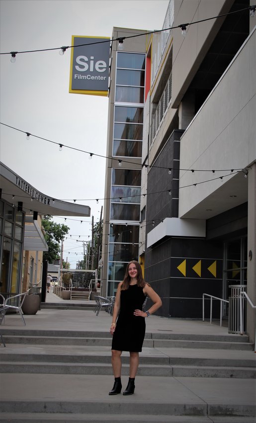 Kelsey Holmes, the membership coordinator for Denver Film, stands outside of the cultural that houses the Sie FilmCenter, 2510 E. Colfax Ave., in Denver.